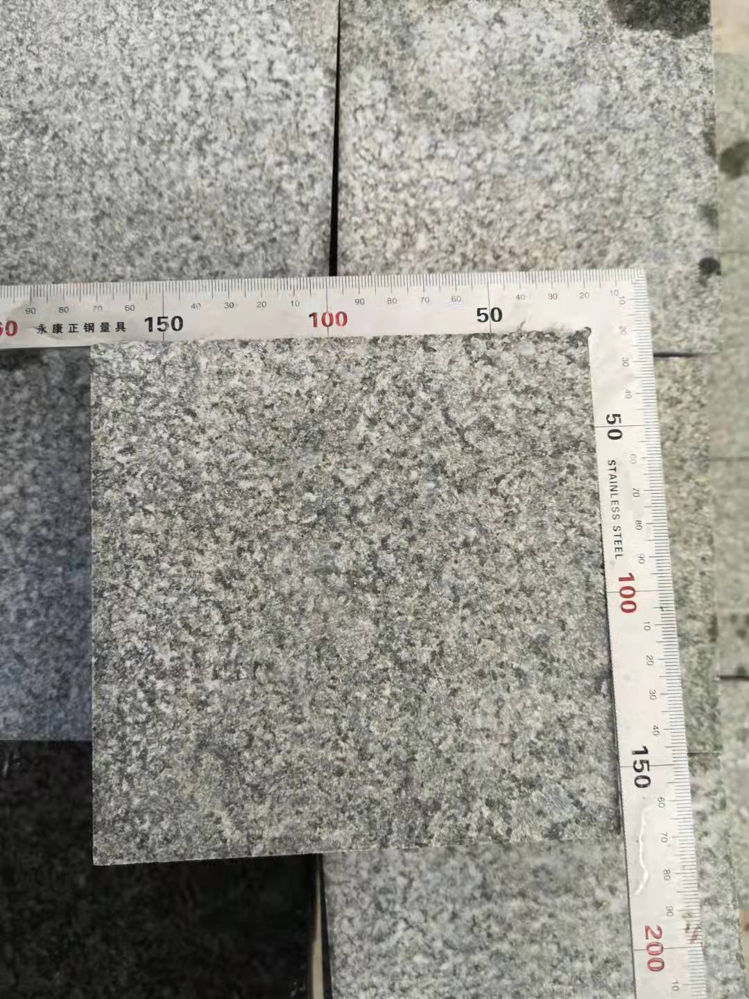 Chengde Green Granite Paver Granite — Verifying cut squareness on finished pavers with a steel angle at Sun Young Stone