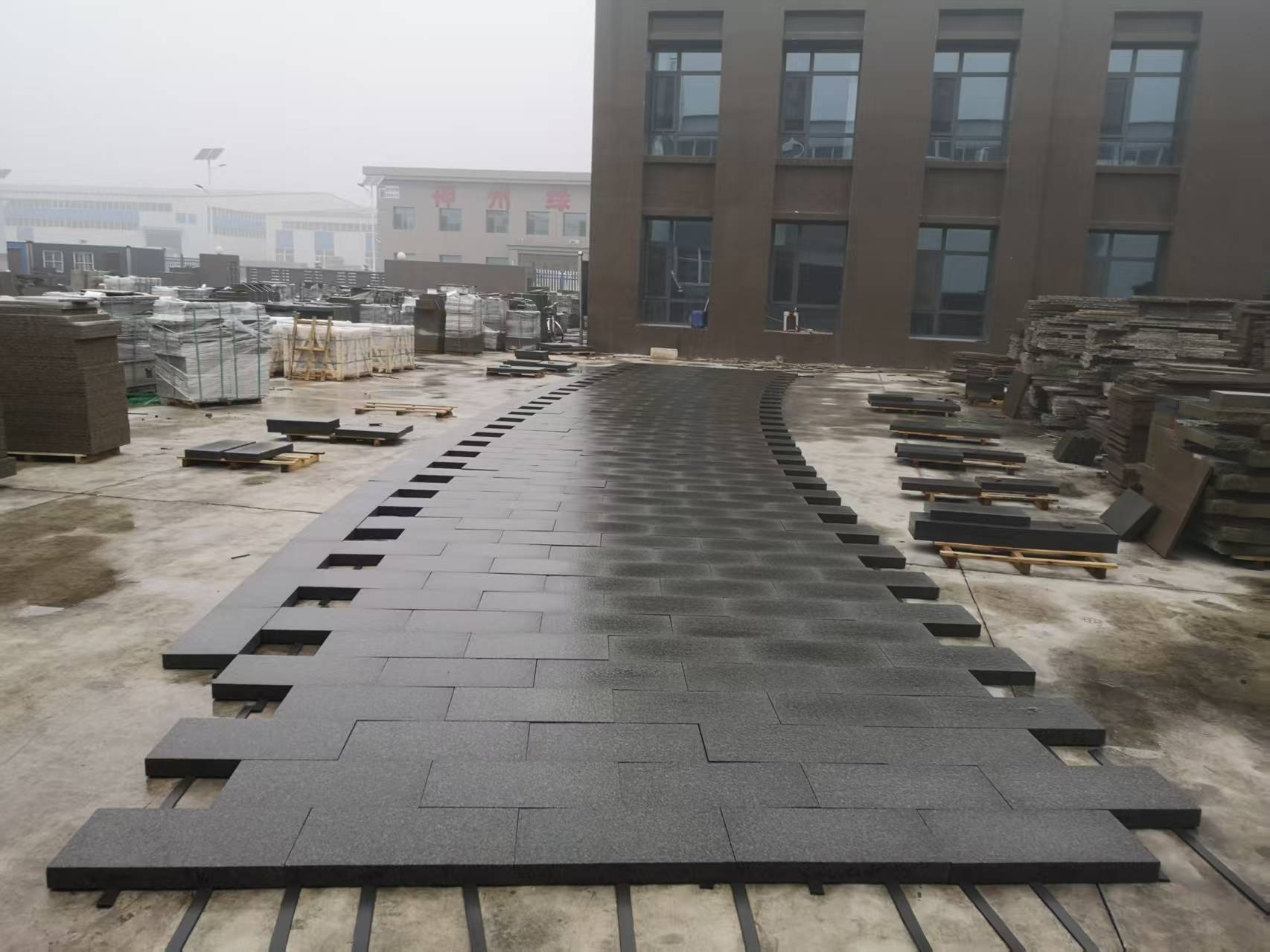 Chengde Green Granite Paver Granite — Dry-laying pavers in a curved walkway pattern for pre-shipment fit check at Sun Young Stone