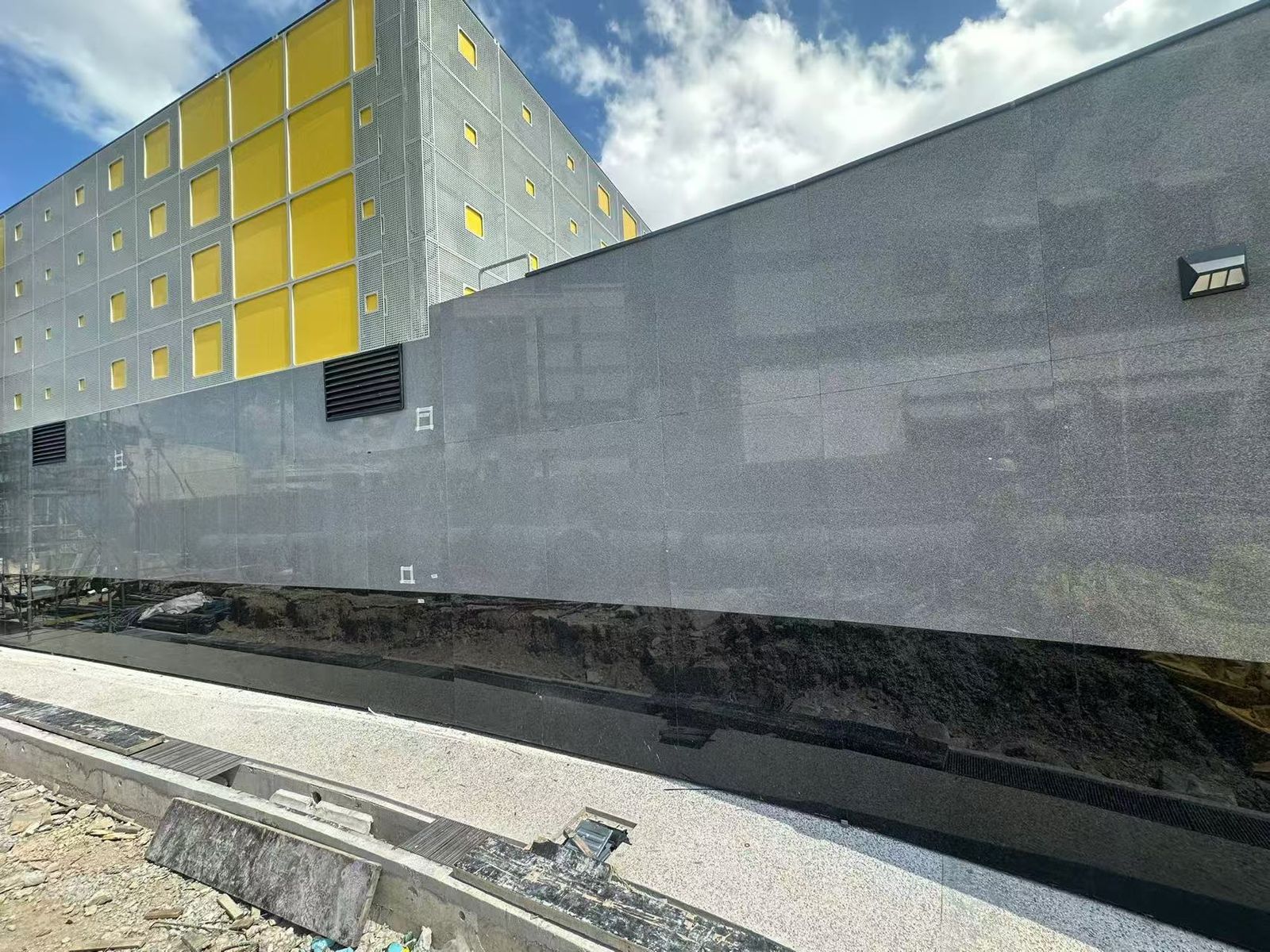Royal Grey Granite (Medium Grey) Granite — Polished Royal Grey granite curtain-wall cladding installed on our Singapore MRT station project