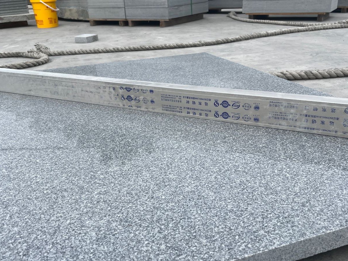 Royal Grey Granite (Medium Grey) Granite — Flatness check: surface trued up with an aluminium straightedge at Sun Young Stone
