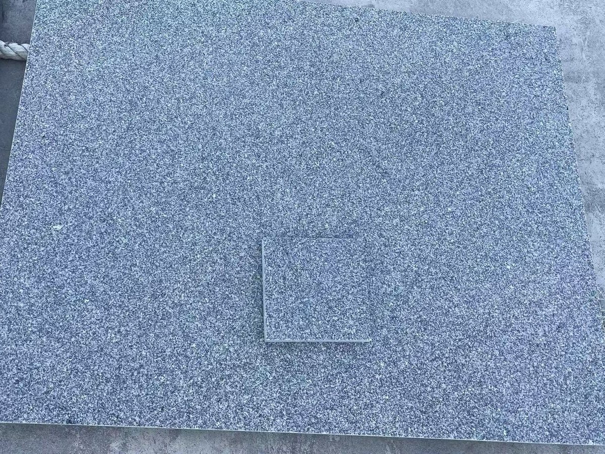 Royal Grey Granite (Medium Grey) Granite — Colour match: finished tile compared against the approved control sample at Sun Young Stone
